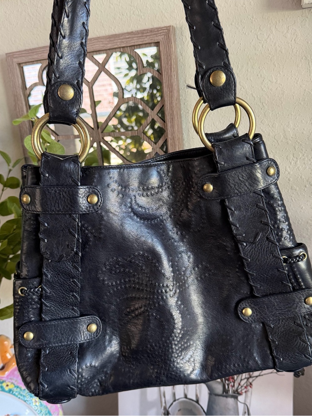 Kooba Sienna black leather handbag with whipstitch and floral embossing